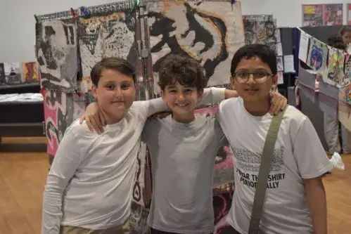 Pupils smiling at Art show
