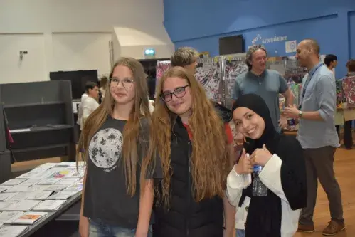 Pupils smiling at Art show